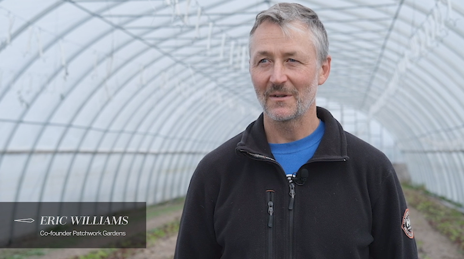 Eric standing in greenhouse
